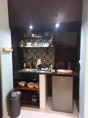 a small kitchen with a counter and a sink at Lucano 1 Stellenbosch in Stellenbosch