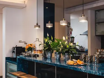 a kitchen with a blue counter with food on it at Boutique Ocean Views - incorporating Wendy's in Hermanus