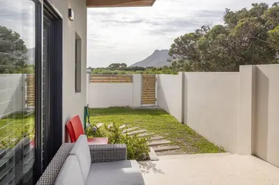 a view from the balcony of a house at Mountain and Sea Cottage in Hermanus