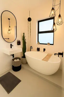 a bathroom with a large white tub and a sink at Green Oasis in Blouberg Hot Tub Kids Paradise in Cape Town
