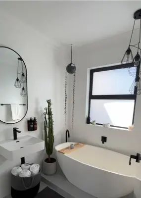 a bathroom with a white tub and a sink at Green Oasis in Blouberg Hot Tub Kids Paradise in Cape Town
