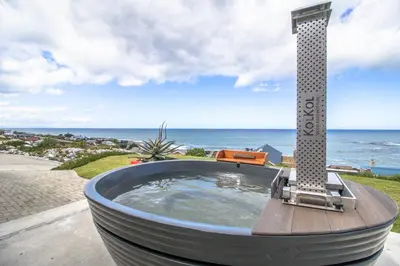 a circular bath tub with a thermometer on top at Jock's View in Bettyʼs Bay
