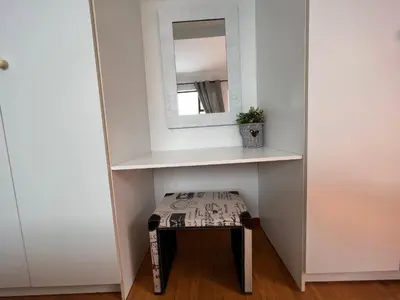 a small stool in a room with a mirror at Coastal House: 3BR+Private Entrance+Self catering in Cape Town