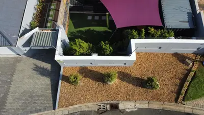 an overhead view of a garden with potted plants at The Leopard Leaf Inn in Cape Town