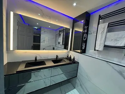a bathroom with two sinks and a large mirror at Exclusive Ultra-Luxury A Cut Above Apartments Century City by Vvip Bookings in Cape Town