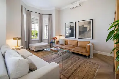 a living room with a couch and a table at Middedorp Manor in Stellenbosch