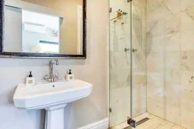 a bathroom with a sink and a shower at Loft de L'Opera - Franschhoek in Franschhoek
