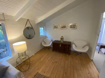 a living room with two chairs and a table at Prometheus in Lake Marina