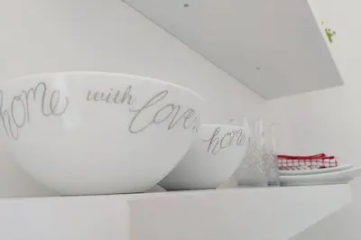 a white bowl with the words love with love on it at Cosy Nest - Uncapped Wi-fi & Self Check-in in Cape Town
