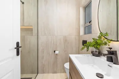 a bathroom with a sink and a mirror at Rancho Relaxo in Bloubergstrand