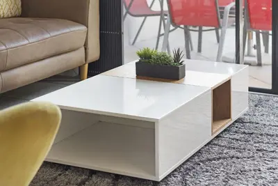 a white coffee table in a room with chairs at Waterstone East C103 by Host Agents in Cape Town