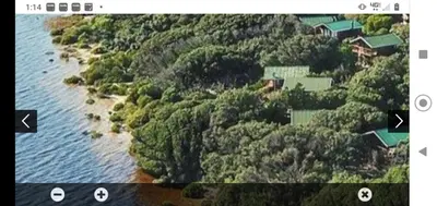 an aerial view of a house on an island in the water at Milkwood Cabin Getaway in Lake Marina
