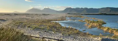 a large body of water with mountains in the background at Milkwood Cabin Getaway in Lake Marina