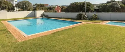 a swimming pool in the middle of a yard at Milkwood Cabin Getaway in Lake Marina