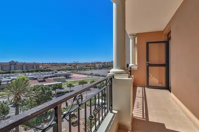 a balcony with a view of a parking lot at 405 Portofino Eyrie Holiday Apartments in Cape Town