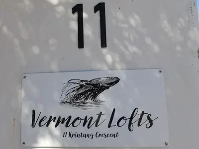 a sign with a drawing of a turtle in the water at Vermont Lofts in Hermanus