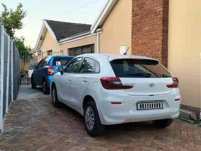 a white car parked in front of a house at Step-by-Step Self-Catering and B&B in Bellville