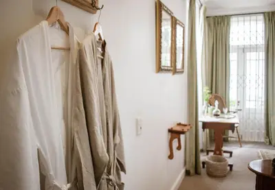 a robe hanging on a wall in a room at Kolonie's Tuin in Stellenbosch
