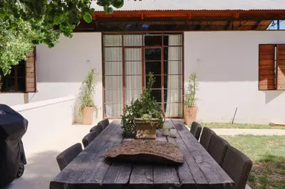 a wooden table with potted plants on top of it at La Villa in Franschhoek
