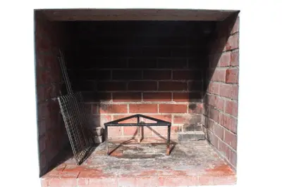 a brick tunnel with a table in it at The Salty Surf Shack in Cape Town