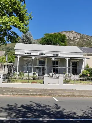 a white house on the side of a street at Ladamon 3 in Paarl