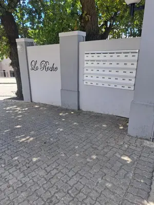 a white fence with the words el rodeo on it at The Lazy Expat - Paarl - Self Catering Apartment in Paarl