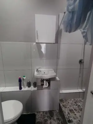 a bathroom with a sink and a toilet at Mila Lodge 1 in Cape Town