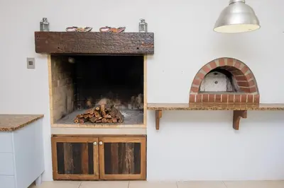a kitchen with a brick oven and a counter top at Eden-Paradys in Stellenbosch
