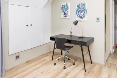 a black desk with a chair in a room at Eden-Paradys in Stellenbosch