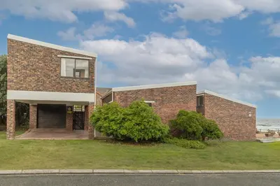 a brick house on the side of the street at The Atlantic in Onrus in Hermanus