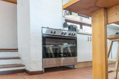 a kitchen with a stainless steel oven in a room at The Atlantic in Onrus in Hermanus