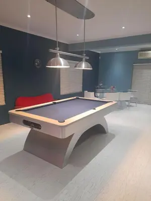 a room with a pool table in the middle of it at S & V Accommodation in Cape Town