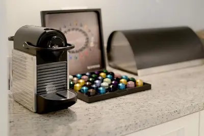 a box of billiard balls sitting next to a toaster at Farm Lorraine Lake Cottage, Loft Cottage and Garden Cottage in Franschhoek