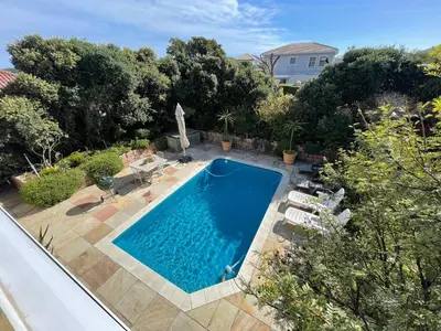 an overhead view of a swimming pool in a yard at De Blauwvoet - Flamingo Apartment in Cape Town