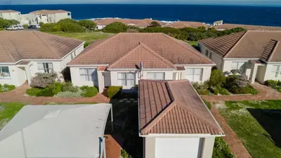 an overhead view of a row of houses with roofs at 241 hermanus beach club in Hermanus