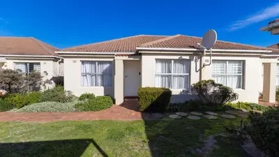 a house in a suburb with a satellite at 241 hermanus beach club in Hermanus