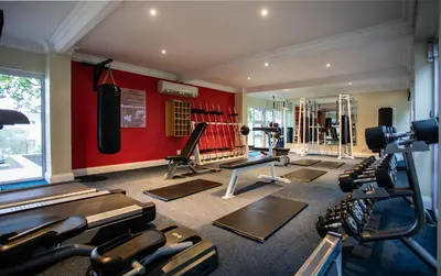 a gym with a bunch of exercise equipment in it at The Caledon Hotel and Spa in Caledon