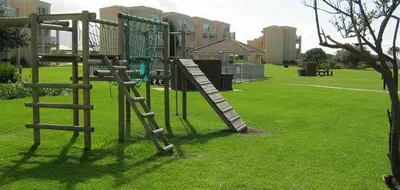 a playground with a slide in a park at Hermanus Sea Breeze in Hermanus