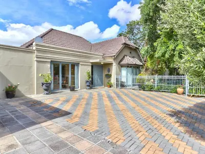 a house with a brick driveway in front of it at Villa Jesdene in Cape Town
