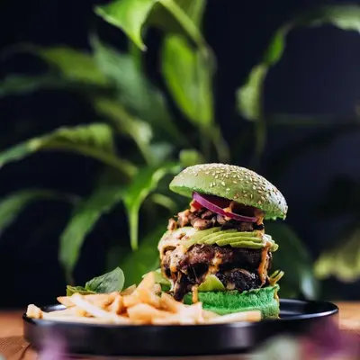 a sandwich on a plate next to some fries at Villa Jesdene in Cape Town