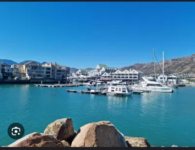a group of boats docked in a harbor at Shalom On The Bay in Cape Town