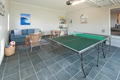 a living room with a ping pong table in it at 3-Bed-Mountain View in Hermanus