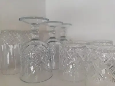 a group of clear glasses sitting on a table at Rondebosch East Garlandale STRICTLY HALAAL, fresh garden cottage in Cape Town