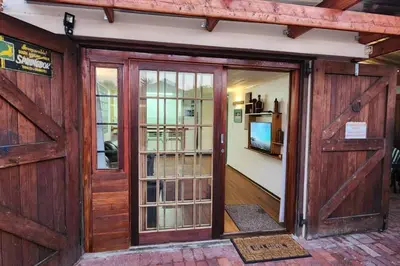 an entrance to a house with a wooden door at De Kelder in Cape Town